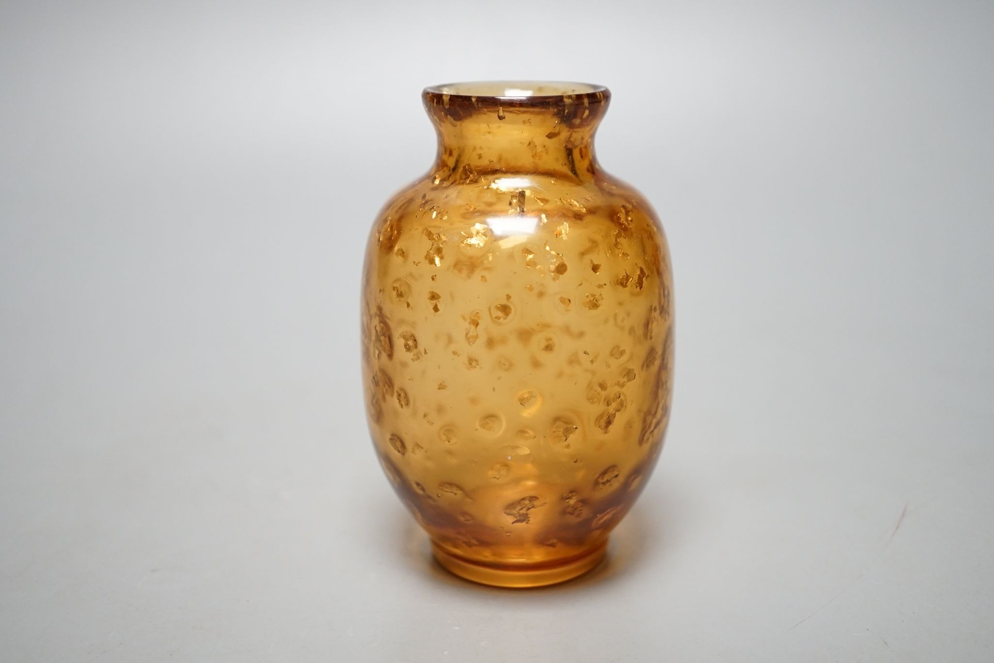A Chinese gilt included amber glass vase., 9 cms high.